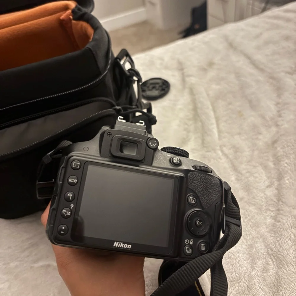 Nikon Black DSLR Camera with Orange Interior Case